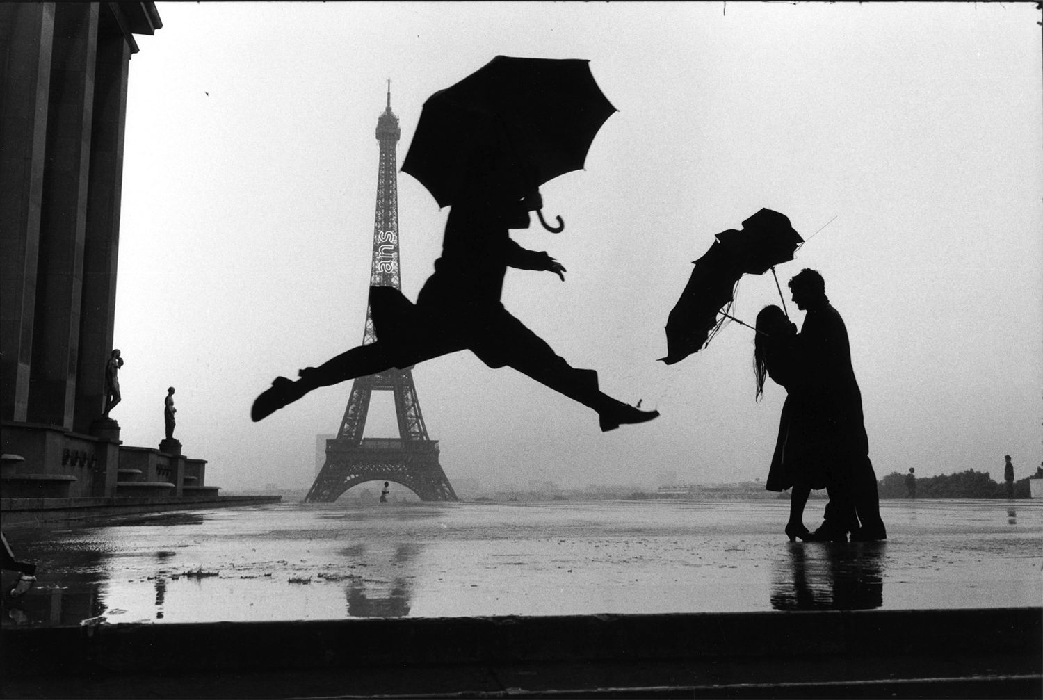 Umbrella Jump in Paris by Elliott Erwitt